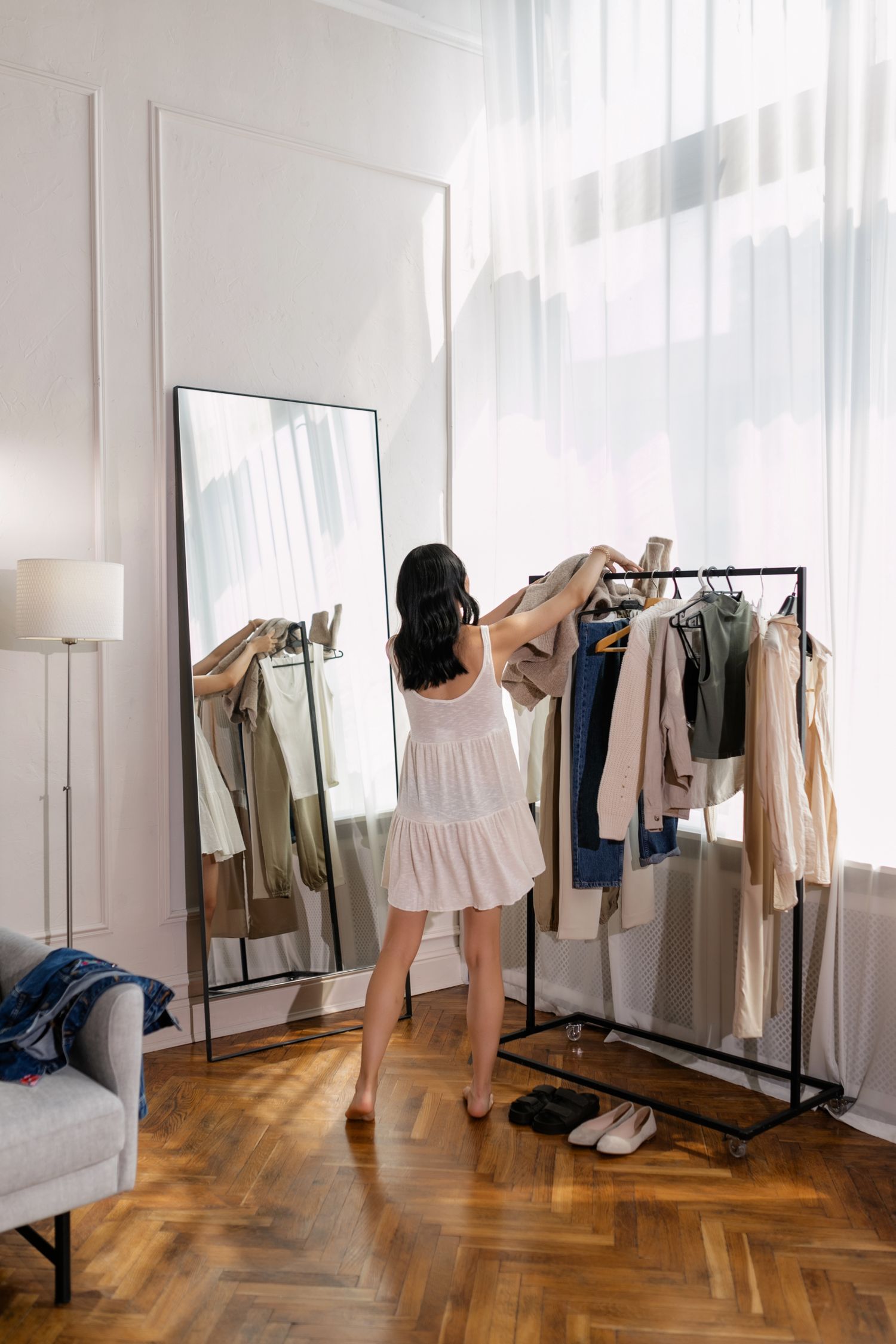 Clothes hanging on a freestanding clothes rack