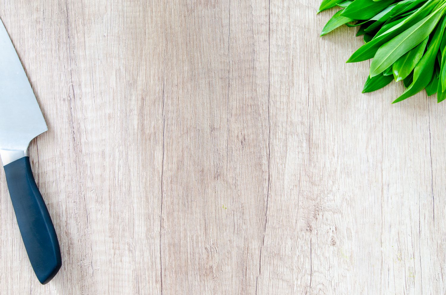 Chef knife on a wooden cutting surface