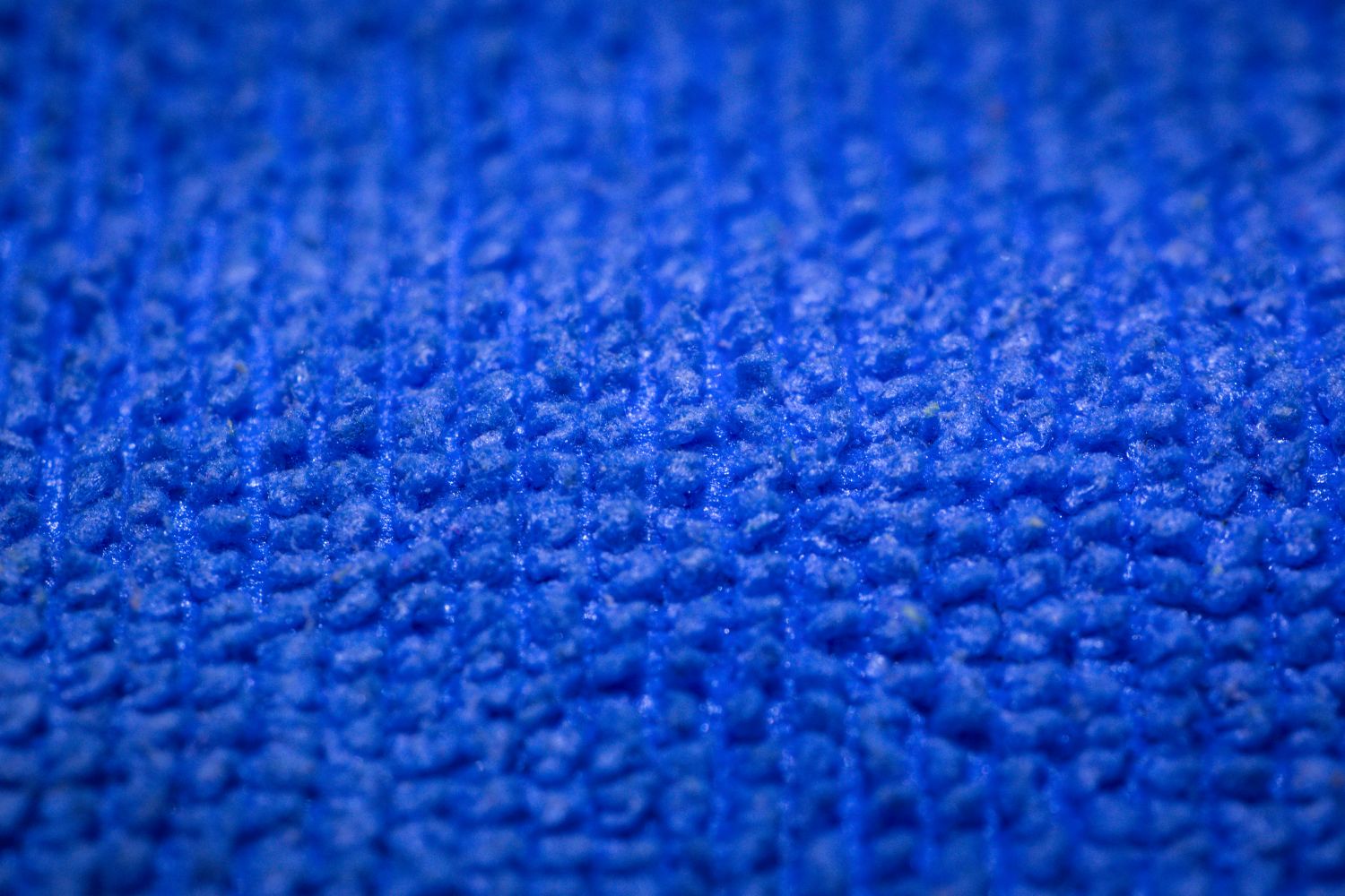 Close-up texture of a blue microfiber cloth